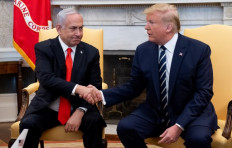 US President Donald Trump shakes hands with Israeli Prime Minister Benjamin Netanyahu as they hold a meeting in the Oval Office of the White House in Washington, DC, Jan. 27, 2020.
