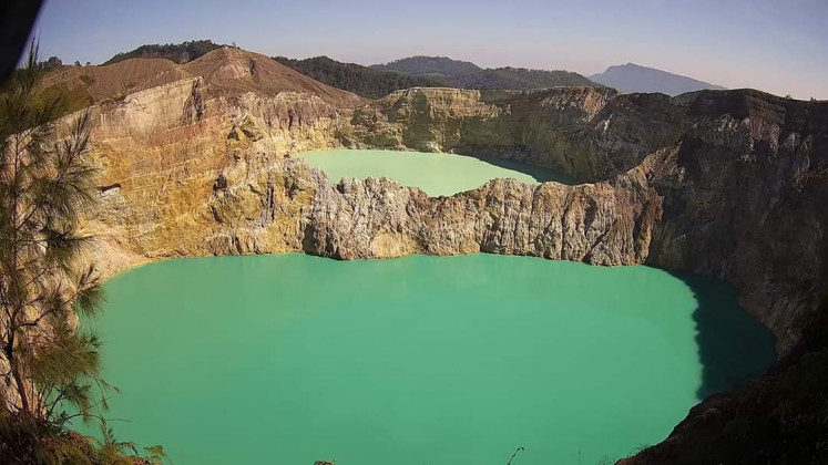 View on volcanic crater lakes of different colors in Kelimutu National Park in Flores, East Nusa Tenggara