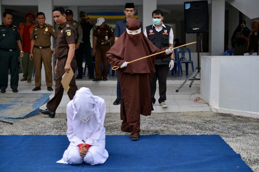 Woman being whipped for removing hijab in public (September 2022