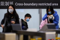 Hong Kong orders masks indoors in public as daily cases hit record
