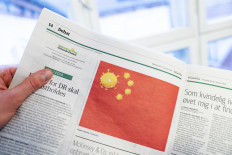 Add to cart Print Share this document
A page of the Danish Daily Newspaper Jyllands-Posten's from the January 27, 2020 edition shows a cartoon made by Danish editorial cartoonist Niels Bo Bojesen of the Chinese national flag with a coronavirus on January 28, 2020 in Copenhagen. 