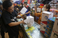 Customers browse different kinds of masks on Jan. 28, 2020 at the Lindeteves Trade Center (LTC) in Glodok, Jakarta.
