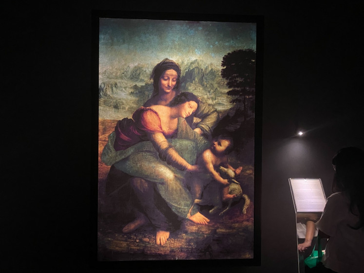 A digital reproduction of 'The Virgin and Child with Saint Anne' by Leonardo da Vinci at the Leonardo Opera Omnia exhibition at Bank Mandiri Museum in Central Jakarta on Feb. 5.