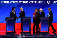 Top hopefuls Buttigieg, Sanders under fire in Democratic debate