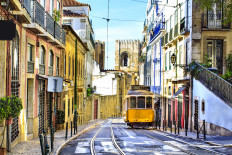 A yellow tram in Lisbon, Portugal.