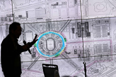 Managing director of the Bung Karno Gelora Complex Center (PPK GBK) Winarto explains the circuit route plan for the Formula E auto competition at the complex, in Senayan, Jakarta, Nov. 2, 2020. The management said they were ready to prepare the GBK complex as the chosen Formula E circuit on condition that they would not use the entire 'ring road' of the GBK Stadium, which was commonly used by the public for sports.