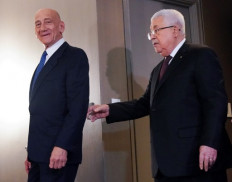 Israel ex-PM Olmert defiantly rallies behind Palestinian leader