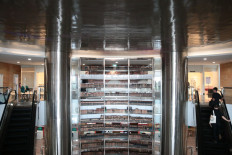 Visitors use the elevator to reach the second floor of the National Library in Central Jakarta on Sept. 3, 2019.