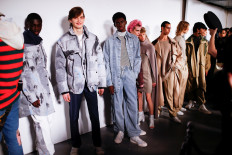 Models present creations during the Studio ALCH catwalk show at London Fashion Week Mens in London, Britain, on January 6, 2020. 