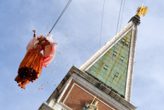 The 'angel' Linda Pani performs as the Angel of the new Carnival on February 16, 2020 by the Bell Tower on St Mark's Square in Venice. 