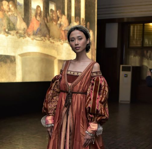 Into detail: A model showcases a costume that used to be worn only by the nobility.