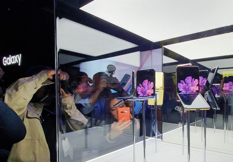 Guests of Samsung Galaxy 'Unpacked' 2020 event flocked around the display of new Samsung Galaxy Z Flip in San Francisco