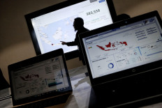 Statistics Indonesia (BPS) staff compile data at the 2020 population census call center in Jakarta, on Feb. 17, 2020 .The population census, which occurs every 10 years, aims to update the country&rsquo;s demographics, which are crucial in supporting policy interventions and combine door-to-door interviews and data gathering and online submission.