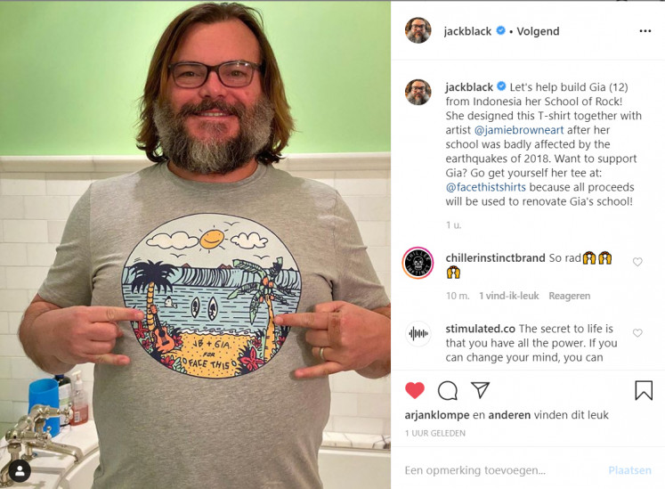 Go Gia: Actor and singer Jack Black poses in a funky T-shirt codesigned by Gia, a 12-year-old from Senggigi, Lombok, in West Nusa Tenggara. 

