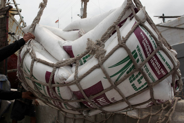 Net worth: Sugar loading and unloading operations are seen on Feb. 16 at Sunda Kelapa Harbor, North Jakarta. 