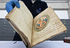 A conservation technician at the Peruvian National Library displays an invaluable manuscript with the memories of the ancient Inca rulers in Lima, on February 20, 2020, which was recovered from collectors in Brazil after disappearing from the library's archives during the occupation of Lima by Chilean troops in the Pacific War (1879-1884). 