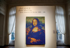 The street art Rubik's Cube version of the 'Mona Lisa' entitled 'Rubik Mona Lisa' made in 2005 by French artist Invader is on display at the Artcurial auction house in Paris on February 3, 2020 before being auctioned next February 23rd. 
