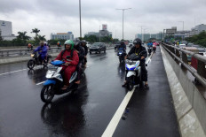 Motorist killed while driving through flood in Central Jakarta