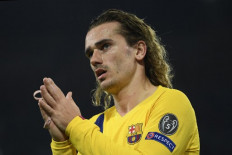 Barcelona's French forward Antoine Griezmann reacts  during the UEFA Champions League round of 16 first-leg football match between SSC Napoli and FC Barcelona at the San Paolo Stadium in Naples on Feb. 25. 