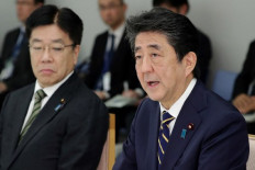 Japan's Abe urges 2-week curbs on sports events as coronavirus looms over Olympics