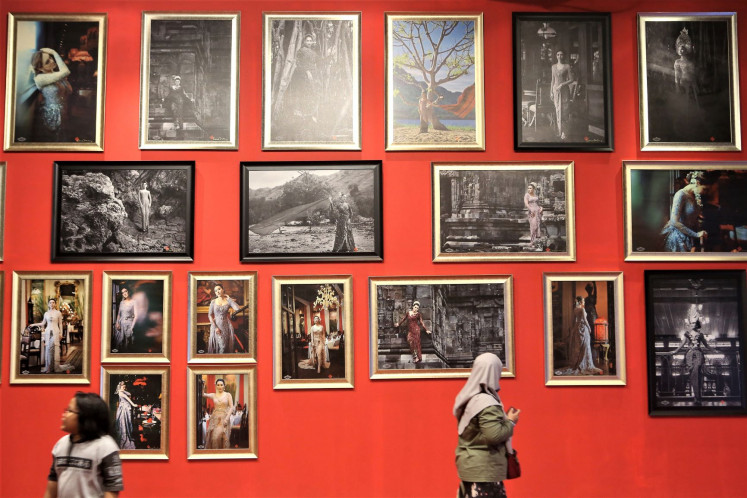 Nod to women: Visitors look at photos on display at 'Perempuan yang Tak Bisa Dieja' (Women who can’t be spelled), the exhibition is a collaboration involving photographer Darwis Triadi, poet Sapardi Djoko Damono and designer Vera Anggraini.  