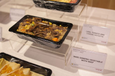 'Nasi goreng sayur dengan daging' (vegetable fried rice with beef) is one of the Indonesian dinner dishes served on select Qatar Airways flights.
