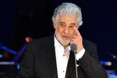 Spanish tenor Placido Domingo gestures as he performs during his concert in the newly inaugurated sports and culture center 'St Gellert Forum' in Szeged, southern Hungary on August 28, 2019. 