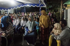 Residents gather to watch a wayang performance in Baledono district in Purworejo regency.  JP/Irene Barlian