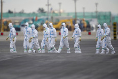 Japan to quarantine visitors from China, South Korea: Yomiuri