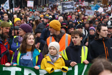 Swedish climate activist Greta Thunberg (center) takes part in a 'Youth Strike 4 Climate' protest march in Bristol, south west England on February 28, 2020. 