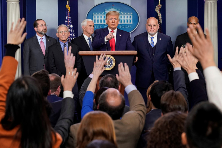 U.S. President Donald Trump takes questions ftom the audience during a news conference on the coronavirus outbreak with U.S. Secretary of Health and Human Services Alex Azar, National Institute of Allergy and Infectious Diseases Anthony Fauci, U.S. Vice President Mike Pence, Director of the Centers for Disease Control and Prevention Robert Redfield and U.S. Surgeon General Jerome Adams at the White House in Washington, U.S., February 29, 2020.  