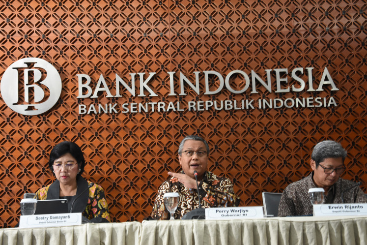 Bank Indonesia Governor Perry Warjiyo (center) accompanied by Senior Deputy Governor Destry Damayanti (left), and Deputy Governor Erwin Rijanto, gave a press statement regarding policy measures to maintain monetary and financial stability due to the impact of the corona virus in the Bank Indonesia Building, Jakarta, Monday (2) / 3/2020). Bank Indonesia prepares five steps to maintain economic stability including increasing the intensity of triple intervention so that the rupiah exchange rate moves according to market fundamentals and mechanisms, decreasing the Statutory Reserves Ratio in Foreign Conventional and Sharia Commercial Banks, and expanding the types of underlying transactions for foreign investors