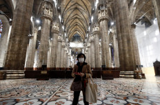 A tourist visits Milan's Duomo cathedral in Italy on March 2, 2020, as it reopened to the public for the first time since the coronavirus outbreak in northern Italy. 