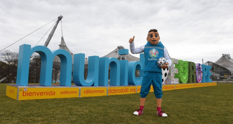 Mascot Skillzy poses on March 3, 2020 in front of the lettering for the upcoming UEFA EURO 2020 in the Olympia Park in Munich, southern Germany, 100 days ahead of its start.