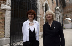 In this file photo taken on May 23, 2018 Yvonne Farrell (R) and Shelley McNamara curators of the 16th International Architecture Exhibition pose in Venice. 
