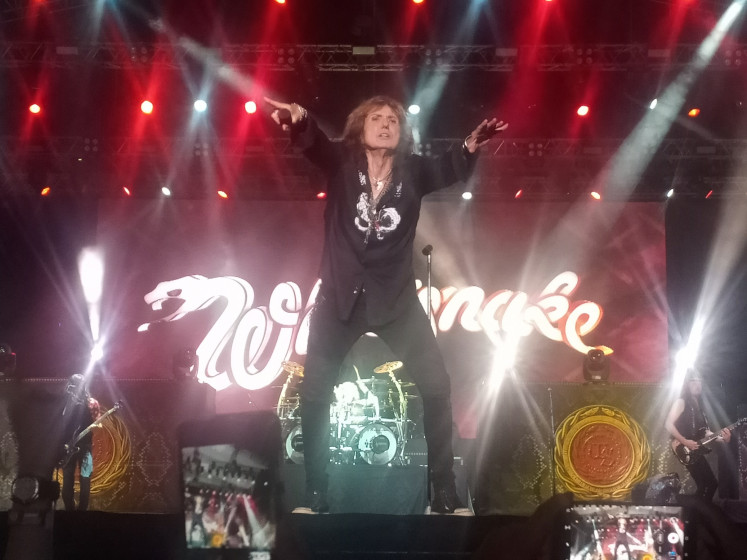 Shout out: British rock band Whitesnake vocalist David Coverdale gestures to the audience during his performance at the JogjaROCKarta Festival #4 2020.