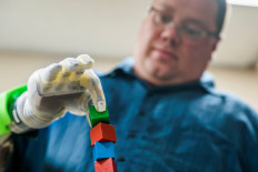 Joe Hamilton intuitively controls a DEKA prosthetic hand, made by Mobius Bionics and called the 'LUKE Arm', for an advanced prosthetics study involving the Regenerative Peripheral Nerve Interface in a lab on the University of Michigan Medical Campus in Ann Arbor, Michigan on August 9, 2018. 