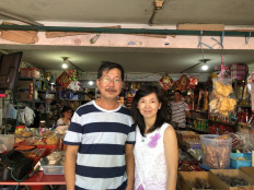 Faith restored: Erwin (left) and his wife Susanna pose in front of their grocery store in Teluk Gong, North Jakarta, on Friday. The couple made waves on social media and received widespread praise for refusing to profit from fears of a COVID-19 outbreak and raise the price of their products.