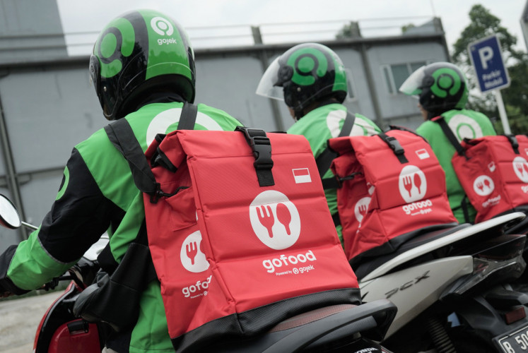 Online ride-hailing platform Gojek provides bags for drivers of the platform's food delivery service, GoFood. 