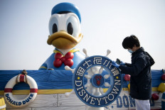 China signals progress in virus battle as Disney partially reopens