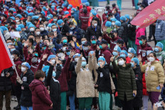 China reports 22 new virus deaths as imported cases rise