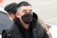Scandal-ridden K-pop star Seungri enlists in army