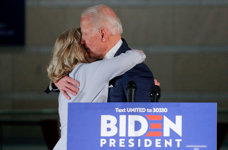 Democratic U.S. presidential candidate and former Vice President Joe Biden hugs his wife Jill after a primary night speech at The National Constitution Center in Philadelphia, Pennsylvania, U.S., March 10, 2020. 