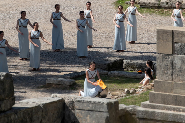 Olympics - Dress Rehearsal - Lighting Ceremony of the Olympic Flame Tokyo 2020 - Ancient Olympia, Olympia, Greece - March 11, 2020   Greek actress Xanthi Georgiou, playing the role of High Priestess lights the flame during the dress rehearsal for the Olympic flame lighting ceremony for the Tokyo 2020 Summer Olympics  