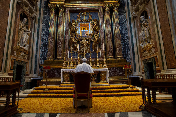 Pope Francis prays at the Santa Maria Maggiore basilica for the end of the coronavirus pandemic, in Rome, Italy March 15, 2020. 
