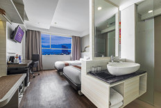 The interior of one of the rooms at FOX Lite Royal Bay Makassar in Makassar, South Sulawesi.