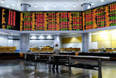 Asian shares stem recent losses, attention on central banks’ tapering