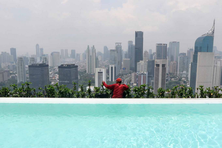 Office buildings fill Jakarta's skyline.
