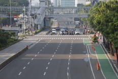 Jl. Thamrin in Central Jakarta experiences a fraction of its usual traffic on March 15.