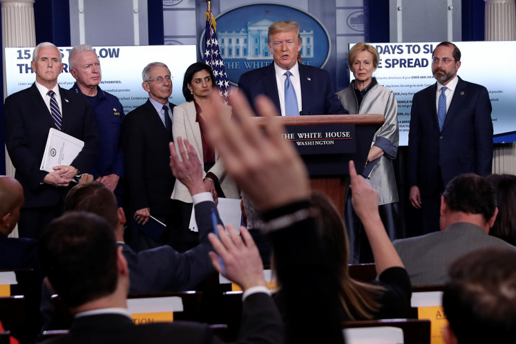 U.S. President Donald Trump takes questions during a coronavirus (COVID-19) task force briefing with reporters at the White House in Washington, U.S., March 16, 2020. 